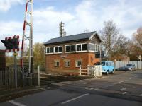 Level crossing and signal box at Moreton-on-Lugg north of Hereford on the Shrewsbury & Hereford Joint line in November 2008. Note the telegraph pole behind the box still retaining its extensive array of cross arms and insulators.<br>
<br><br>[John McIntyre 18/11/2008]