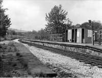 <I>Scene of the demo</I>. When the Accrington line closed and the Bacup line was cut back to Rawtenstall on 5th December 1966 the service at Summerseat was drastically cut mid-timetable, losing around 75% of its weekday trains. The incensed locals held a demonstration and blockade at the station and several arrests were made.  Services were still pruned though but the line lingered on for a further few years. However, as can be seen, buildings were demolished and the replacement shelter was less than basic and clearly not intended to last. Note however the 2, 4 and 6 <I>Car Stop</I> signs still in place on the disused down platform in this view towards Ramsbottom. [See image 21959] for a modern day 'Then and Now' comparison.<br><br>[W A Camwell Collection (Courtesy Mark Bartlett) 27/05/1972]