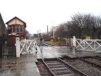 Full credit to the East Lancashire Railway for their restoration at Ramsbottom, which includes reinstating the wheel operated level crossing gate mechanism.  Here the gates are opened to road traffic after the DMU has departed for Rawtenstall.<br><br>[Mark Bartlett 13/12/2008]