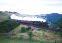 <I>Jubilee</I> 4-6-0 no 45593 <I>Kolhapur</I> heads north through Drumlanrig Gorge between Enterkinfoot and Sanquhar in the 1960s. [See image 32746]<br><br>[Robin Barbour Collection (Courtesy Bruce McCartney) //]