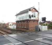 Although closed for nearly 80 years the intermediate stations between York and Malton have lots of infrastructure. In many cases this includes station buildings, platforms and mechanical signal boxes.  The impressive box at Strensall still controls the level crossing by the former station, albeit by electrical rather than mechanical means and colour light signals in this case. View towards Malton.<br><br>[Mark Bartlett 15/12/2008]
