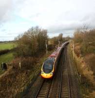 A down Pendolino is seen from a footbridge on the WCML just north of Preston on 24 January 2009. The train is about to pass under the A6 on its journey to Lancaster.<br>
<br><br>[John McIntyre 24/01/2009]