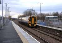 Standing on the recently commissioned platform at Uphall station on 29 January looking towards Edinburgh, as 158 735 pulls into the westbound platform with a Bathgate service.<br><br>[David Panton 29/01/2009]