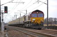 Pathfinder <I>Forth McFreighter</I> railtour approaching St Germains level crossing on 8 February with EWS 66201 leading on the leg to North Berwick.<br><br>[Bill Roberton 08/02/2009]
