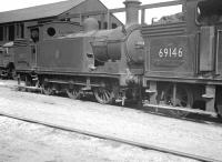 Reid N15 0-6-2T locomotives 69182 and 69146 at Eastfield shed c.1959. Note the wire and pulley attachment on the former, used to release the slip-coupling after banking trains out of Queen Street up the 1 in 45 Cowlairs Incline. <br>
<br><br>[K A Gray //1959]