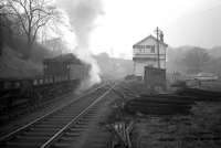 Q6 63379 clatters past Beamish signal box on a misty morning in February 1964 with a train of flats heading for Consett steelworks.<br><br>[Robin Barbour Collection (Courtesy Bruce McCartney) 15/02/1964]