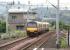 320307 leaving Dumbarton Central with a service for Airdrie on 10 July 2005. The train is about to pass the redundant signal box located just east of the station.<br><br>[John Furnevel 10/07/2005]