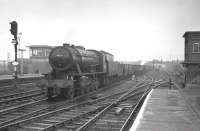 Ex-WD Austerity 90001 brings a train of coal empties south through Doncaster in April 1963.<br><br>[K A Gray 11/04/1963]