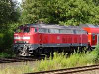 DB 218 407-5 with a train approaching Lubeck, on the Baltic coast, on 28th July 2007.<br><br>[John Steven 28/07/2007]
