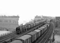 Occupation of all lines north of Carlisle in the mid 1960s as Britannia Pacific 70035 <I>Rudyard Kipling</I> crosses the Eden with a northbound train. Withdrawn from Kingmoor shed at the end of 1967, no 70035 was one of the 35 ex-BR steam locomotives recorded as having been cut up in the yard of T W Ward, Inverkeithing, in this case in March 1968.  <br>
<br><br>[Robin Barbour Collection (Courtesy Bruce McCartney) //]