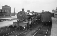 40920 in a bay platforms at Dumfries in April 1958. The former Caledonian goods shed on the left looks over the station.<br><br>[Robin Barbour Collection (Courtesy Bruce McCartney) 15/04/1958]