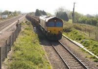 EWS 66156 westbound on a stone train through Pilning, at the eastern end of the Severn Tunnel on 21 April, running slowly through the loop towards the Tunnel.<br><br>[Peter Todd 21/04/2009]