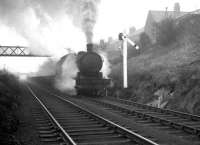 A hard working Q6 no 63379 climbs through Beamish past a notable North Eastern signal post hauling empty steel flats destined for Consett on 15 February 1964.<br><br>[K A Gray 15/02/1964]