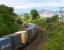 A northbound DRS class 66 rounds the curves near Cowie on 28 May 2009 hauling the Grangemouth - Aberdeen containers. Stirling Castle dominates the background - with a definite touch of 'Walt Disney' about it...<br><br>[John Furnevel 28/05/2009]