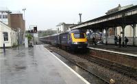 First Great Western HST, with power car 43063 leading, arrives at the end of its journey in rain soaked Paignton on 6 June 2009. The water level between the tracks was slowly rising and expanding during the afternoon as the English Riviera resort was battered by wind and rain.<br><br>[John McIntyre 06/06/2009]