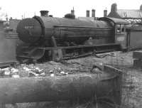 Gresley class D49 no 62727 <I>The Quorn</I> awaits the cutter's torch in Darlington works scrapyard on 12 March 1961, around 2 months after being withdrawn from  53A  Hull Dairycoates shed. Disposal date is recorded as 7 weeks later on 30 April 1961. [Note the locomotive's nameplate is still attached!]<br>
<br>
<br><br>[David Pesterfield 12/03/1961]