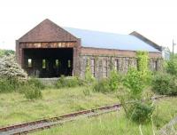 Remains of the former locomotive shed at Stranraer in May 2007. Located just to the east of Stranraer Town station, the shed was officially closed in October 1966. This building and part of the yard were subsequently used by a scrap merchant for several years, during which time the building received a new roof. <br><br>[John Furnevel 31/05/2007]