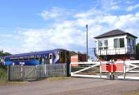 A southbound service on the ex-GSWR route about to run over Holywood level crossing on 10 June, heading for its next stop at Dumfries. This is one of the very few level crossings that is manually operated from the box by wheel.<br><br>[David Forbes 10/06/2009]