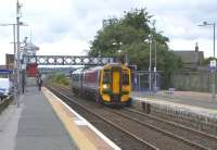 158 715 for Inverness calls at Dyce on 15 June. My photography appears to be attracting the frank curiosity of the chap on Platform 2.<br><br>[David Panton 15/06/2009]