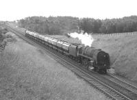 A 9F 2-10-0 with a northbound cement train near Braidwood on Glasgow Fair Saturday in July 1966.<br><br>[Colin Miller /07/1966]
