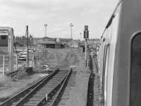 View from the BLS <I>Lothian and Fife Wanderer</I> DMU railtour on 23 August 1980 as it passes the truncated siding into Leith Walk East goods (latterly a parcels depot) on the way to Granton.<br><br>[Bill Roberton 23/08/1980]