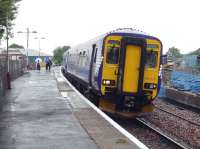 Glasgow bound 156433 awaits its departure time at Stewarton in between showers on 14 July. Evidence of the ongoing building work at the station can be seen in the background.<br>
<br><br>[John Steven 14/07/2009]