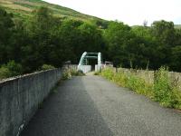 A view along the trackbed of the Edinchip Viaduct north of Balquhidder on the way to Lochearnhead. Being made of metal the original centre span was removed for scrap on closure. The substantial new centre span has given new life to the viaduct as part of a long distance path/cycleway. A plaque on the viaduct relates the unfortunate circumstances of how the funds were raised. <br><br>[John Gray 25/07/2009]