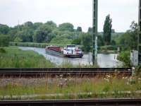 An earlier mode of transport passes under the railway at Lubeck in July 2009.<br><br>[John Steven /07/2009]