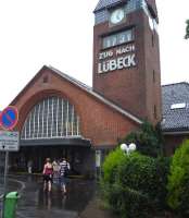 The approach to Travemunde Strand station in July 2009. The station clock shows a few minutes after 5pm, with the panel below displaying the time of the next train departure, the 17.31 service to Lubeck.<br>
<br><br>[John Steven /07/2009]