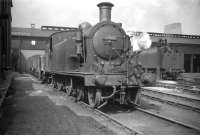 One of the push-pull fitted Reid ex-NB C15s no 67460 at Eastfield in July 1959. The locomotive was used on the Craigendoran - Arrochar service for many years along with classmate 67474 [see image 24286]. Built by the Yorkshire Engine Co in 1912, withdrawal of both (the last surviving examples) took place in April 1960, at which point a diesel railbus took over the service. Both C15s were cut up at Cowlairs works the following month.<br>
<br><br>[Robin Barbour Collection (Courtesy Bruce McCartney) 29/07/1959]