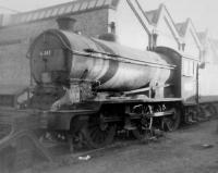 J39 0-6-0 no 64747 in a siding alongside Woodford Halse shed in October 1963. A village in rural Northants with a population of around 1,500, Woodford Halse was transformed with the arrival of the GCR London extension. This resulted in construction of a large locomotive shed and goods yard, with housing and other facilities for railway workers.  How times change. The station, shed and yards were closed in the mid 1960s and the village has now returned to its former quiet rural state with little sign that the railway was ever there. <br>
<br><br>[David Pesterfield 20/10/1963]