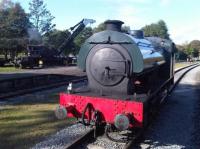 Ex MOD 0-6-0 Saddle Tank WD 150 sits between turns at Rowsley Station, with steam crane to left giving re-railing demonstrations. <br><br>[David Pesterfield 11/10/2009]