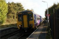 A Northern Rail Hazel Grove to Preston service passes Adlington station at speed on the afternoon of 16 October 2009. Standing behind the yellow line is not so easy at this station due to the narrowness of the platforms.<br><br>[John McIntyre 16/10/2009]
