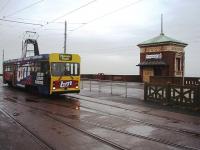 OMO (One man operated) <I>Centenary</I> tram 647 is about to use the crossover in the foreground to reverse at the Cabin and go back to the Pleasure Beach on a very overcast day. The Cabin Lift in the background takes pedestrians down over forty feet to the lower promenade. 647 worked until the very last day of traditional trams in service, in November 2011.<br><br>[Mark Bartlett 06/10/2009]