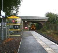 The short platform at Beauly on 3 October looking towards Muir of Ord. A non-stop 158 service running north through the station at speed stirs up some of the autumn leaves lying below the bridge. <br><br>[John Furnevel 03/10/2009]