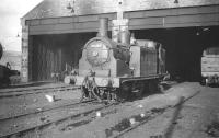 McIntosh 2P no 55185 stands at Keith shed in March 1959. The locomotive was withdrawn by BR in July 1961 following official closure of the shed to steam the previous month. 61C continued to be used as a diesel depot until the mid 1970s. The site later became a Chivas Brothers whisky bond, with the north wall of the old shed being incorporated into one of the new buildings [see image 5347].<br><br>[Robin Barbour Collection (Courtesy Bruce McCartney) 25/03/1959]