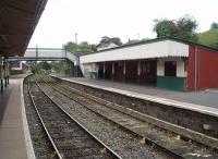 The Down side waiting shelter at Newtown is a large affair, as seen in this view looking towards Welshpool. All movements on this line operate on the Radio Electronic Token Block system. <br><br>[Mark Bartlett 17/09/2009]