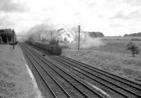 S15 30499 passes Winchfield, Hampshire, in 1960 with a westbound freight.<br><br>[John Thorn //1960]