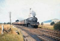 Jubilee 4-6-0 no 45617 <I>Mauritius</I> approaching Symington with a southbound WCML train on 28 August 1959.<br>
<br><br>[A Snapper (Courtesy Bruce McCartney) 28/08/1959]