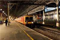 A southbound mail train waits on platform 4 at Preston station on the evening of 26 November 2009 for a path to Warrington.<br><br>[John McIntyre 26/11/2009]