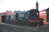 A trio of class 08 shunting locomotives stabled on Eastfield shed in May 1959. This was BRs most numerous locomotive class with 996 units being built between 1953 and 1962. The only identifiable example in this photograph, nearest the camera, is D3396. This became 08326 on renumbering and was eventually withdrawn by BR in October of 1983.<br><br>[A Snapper (Courtesy Bruce McCartney) 23/05/1959]