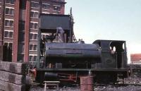 Peckett 0-4-0ST <I>Victoria</I>, built as 2028/1942 for the Royal Ordnance Factory at Sellafield, is seen here being watered outside the Quaker Oats building at Whitehaven Harbour in 1968. It worked here for a further three years. <br><br>[David Hindle //1968]