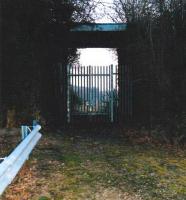 Not as it seems, part 1 - a tall and secure gate and fence like this are not what the dedicated railway walker wants to see - in this case, on Birch Coppice #4 pit line (see images 25983 and 25985). However, the former 'main line' from the MR at Kingsbury to Baxterley passes overhead. By scrambling up the embankment and down again, one can rejoin the trackbed on the far side of the fence. Our exploration of this line was fitted in after buying a plumbing fitting in the industrial estate adjacent to the freight terminal built on the site of Birch Coppice (#1) pit. We were quizzed by Security, but allowed to continue!<br><br>[Ken Strachan 18/03/2009]