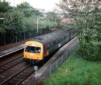 Experimental-liveried 101 692 pulls out of Cumbernauld with a Motherwell service (its usual diagram) in September 1997.<br><br>[David Panton /09/1997]