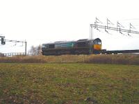 DRS 66419 waits at signals near Winsford on 24 November 2009 with a John G Russell return working to Scotland from Daventry International Rail Freight Terminal. <br><br>[David Pesterfield 24/11/2009]