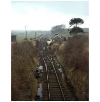 Track lifting in progress at Wigtown station on the Whithorn branch in April 1965. View south over the former station from the bridge carrying Harbour Road. Wigtown lost its passenger service in 1950 with the branch back to Newton Stewart finally closing in 1964. <br><br>[Frank Spaven Collection (Courtesy David Spaven) /04/1965]