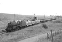 Northbound goods passing Craigenhill Summit on Glasgow Fair Saturday in July 1966. The locomotive is thought to be Black 5 no 44870.<br><br>[Colin Miller /07/1966]