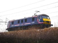 First ScotRail liveried EWS 90021 runs north light engine approaching Winsford Station on 13 January 2010.<br><br>[David Pesterfield 13/01/2010]