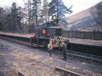 A track-lifting locomotive stands at Balquhidder station in December 1966. It was here in the early hours of 27th September 1965 that the 12.30 am Stirling-Oban train was halted after reports of a landslide to the north in Glen Ogle. Following an engineers' inspection the decision was eventually taken that the landslip was too serious to remove, just five weeks before the scheduled closure of the route.<br>
<br><br>[Frank Spaven Collection (Courtesy David Spaven) /12/1966]