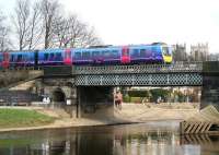 A nice day for a stroll along the north bank of the river on 21 March 2010, just as the 1347 Scarborough - Liverpool Lime Street First TransPennine Express service crosses the Ouse on the eastern approach to York station.<br><br>[John Furnevel 21/03/2010]